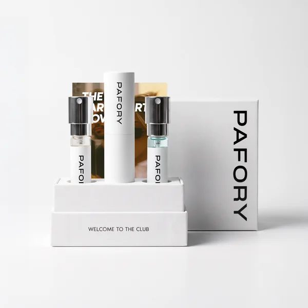 The PAFORY Member Box with the white case and two 8 ml scents, next to its packaging
